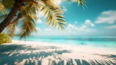 A softly blurred vision of a tropical beach, evoking the hazy warmth of a summer day by the sea with palm leaves in the foreground.の素材