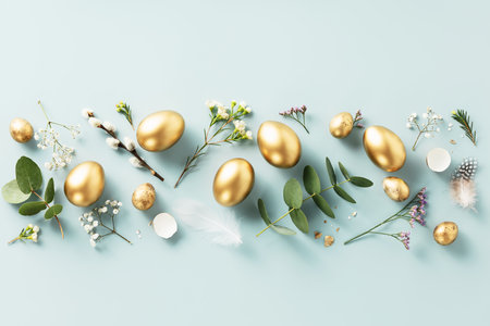 golden quail eggs, feathers and spring flowersの写真素材