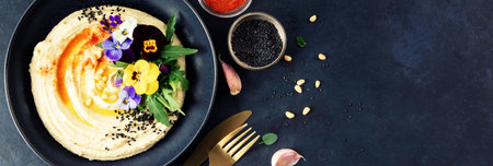 Gourmet Hummus with Edible Flowers, Pine Nuts, and Olive Oil, Banner Imageの写真素材