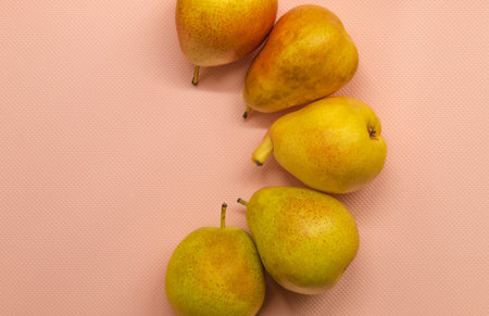 View from above on the ripe, overripe fruit that is placed on the pink background of the horizontal...