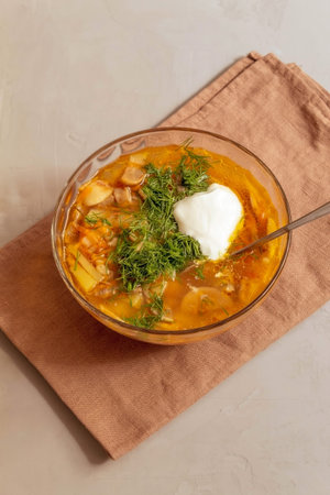 The picture shows hot food. It's mushroom soup. It is in a deep glass plate. The soup is made from...