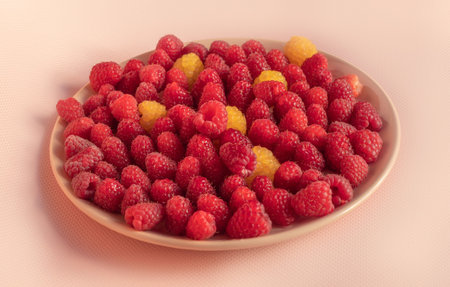 The photo shows a wide range of fresh garden berries grown at home. These are cherries, raspberries,...