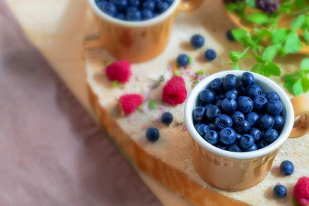 The photo shows an image of fresh summer food. These are ripe garden berries from the village.