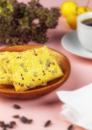 The photo shows the atmosphere of breakfast. There are rectangular-shaped crunchy crackers and one cup of black coffeeの写真素材