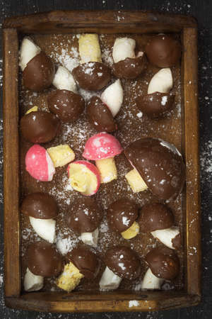 There are sweets for tea in the form of mushrooms in a wooden boxの写真素材