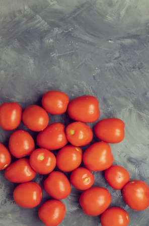 Top view of a small number of red tomatoes that have the shape of a plumの写真素材