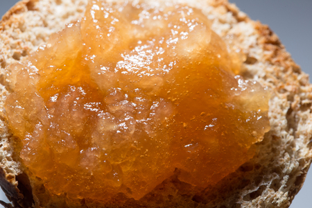 Apple jam with bubbles layered on toasted bread close upの写真素材