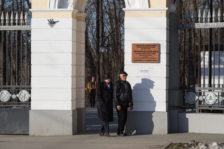 MOSCOW, RUSSIA - APRIL 9, 2018: An elderly couple at the entrance to the Lefortovo Park in Moscow. Lefortovo Park (originally Golovin Garden, also known as Versailles on the Yauza) is a Moscow historical and natural monument of architecture and landscape のeditorial素材