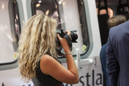 MOSCOW, RUSSIA - MAY 23, 2015: Women photographer at the 8th International Helicopter Industry...