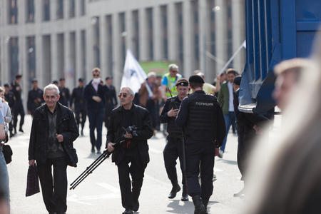 MOSCOW, RUSSIA - APRIL 30, 2018: Protesters leave the rally with posters and paper airplanes. A rally on Sakharov Avenue against blocking the Telegram app in Russia. Against Internet censorship.のeditorial素材