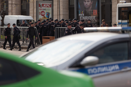 MOSCOW, RUSSIA - APRIL 30, 2018: The police cars and Rosgvardia are cordoned off after a rally on Sakharov Avenue against the blocking of the telegram in Russia. Against censorship on the Internet.のeditorial素材