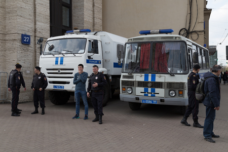 MOSCOW, RUSSIA - APRIL 30, 2018: The police cars and Rosgvardia are cordoned off after a rally on Sakharov Avenue against the blocking of the telegram app in Russia. Against censorship on the Internetのeditorial素材