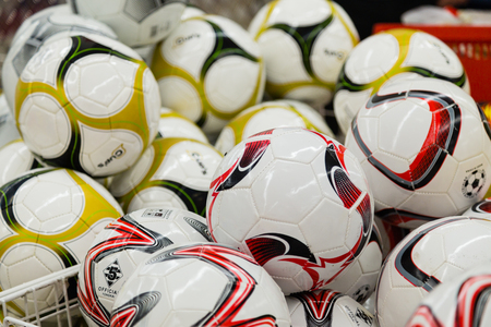 MOSCOW, RUSSIA - APRIL 27, 2018: Colored soccer balls in the supermarket Auchan.のeditorial素材