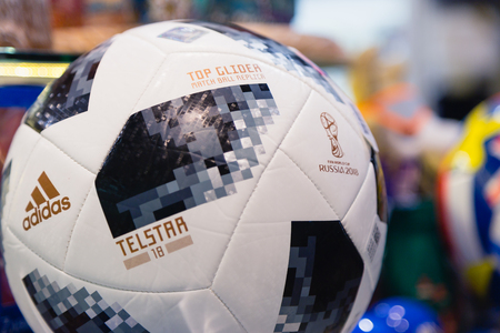 MOSCOW, RUSSIA - APRIL 30, 2018: Copy of a soccer ball with inscription TOP GLIDER match ball replica and TELSTAR emblem and ADIDAS logo of the World Cup FIFA 2018 mundial in the souvenir shop.のeditorial素材