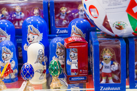 MOSCOW, RUSSIA - APRIL 30, 2018: Zabivaka is the official mascot of the 2018 FIFA World Cup mundial, which will be held in Russia. Souvenir shop shelf. Representing an anthropomorphic wolf doll.のeditorial素材