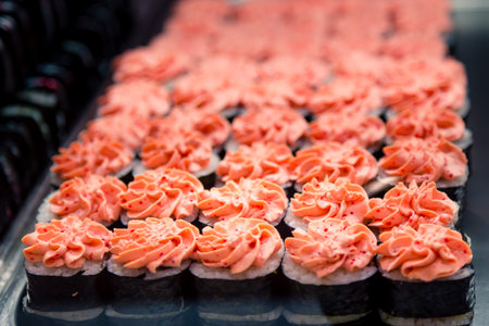 Rolls in the window in the sushi bar. Traditional Japanese food to takeaway. Organic natural products. Seafood. Serving delicacies.の写真素材