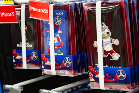 MOSCOW, RUSSIA - April 21, 2018: Iphone case in a gift shop with World Cup FIFA 2018 mundial symbols. Souvenir store. National russian flag colors.のeditorial素材