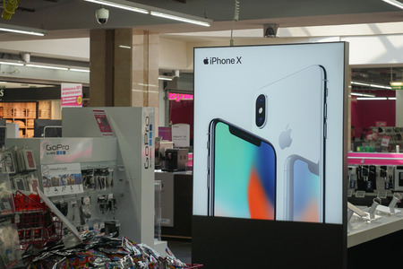 MOSCOW, RUSSIA - APRIL 6, 2018: Advertising Apple Iphone X in MediaMarkt store in Yerevan Plaza shopping mall. Safmar group agreed to purchase a network of home appliances and electronics Media Markt.のeditorial素材
