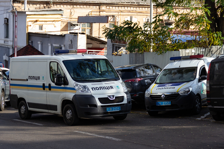 DNIPRO, UKRAINE - NOVEMBER 1, 2018: Police vans parked in the street opposite the building of the National Police Department in Dnepropetrovsk region.のeditorial素材