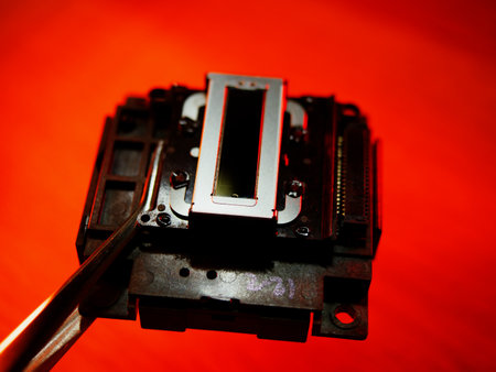 Inkjet Print Head details. Piezoelectric Printing Technologies. Miniature Color Ink Jet Nozzles for Photorealistic High Resolution Printing. Control cable connector.の写真素材