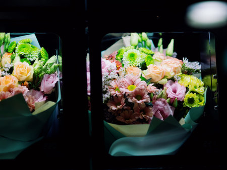 Bouquets of flowers in the cells of a flower vending machine. Self-service machine for selling gift bouquets of fresh flowers. Vending machine. Small business. December 31, 2024 - Pula, Croatiaの写真素材