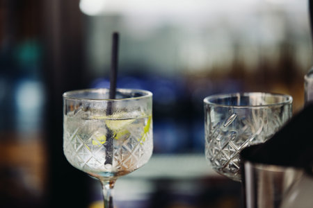 A glass with an unfinished drink in a wine glass at a beach cafe. Fast food cocktail. Fazana, Croatia - circa 2025の写真素材