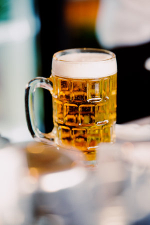 Ice cold beer in a glass. Summer evening.の写真素材