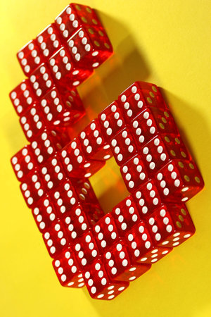 The number six made out of red dices with six side up