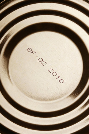 Close-up of canned food with expiration dateの写真素材