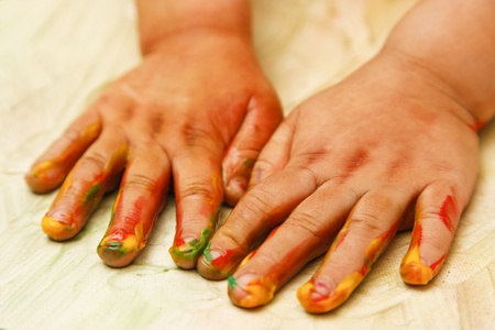 Young child painting with hands - shallow depth of focusの写真素材