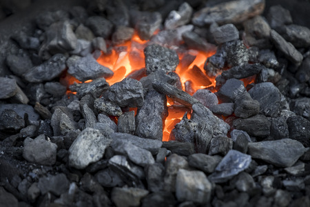 Blacksmiths coals burning for iron workの写真素材