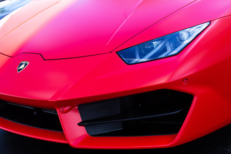 Miami, FL, USA - April 16, 2019: Luxury Red Lamborghini  Parked In The Street Of Broward.  The Lamborghini  is an SUV manufactured by Italian car manufacturerのeditorial素材