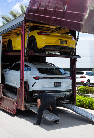 Miami, FL, USA - April 16, 2019: New Luxury Italian Sport Cars in a Big Delivery Truck for Batch...