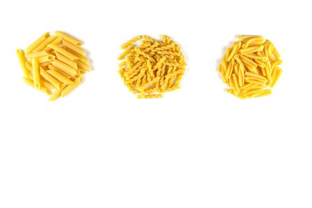Various kind of raw Italian pasta isolated on white background. Food and drink concept , uncooked pasta on white background. Top view. Copy Spaceの写真素材