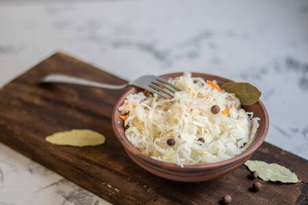 Plate with sour cabbage. This is a useful fermented product. Sour cabbage is rich in vitamins and is used in many dishes of different nations. The fermentation process does not destroy nutrients.の写真素材