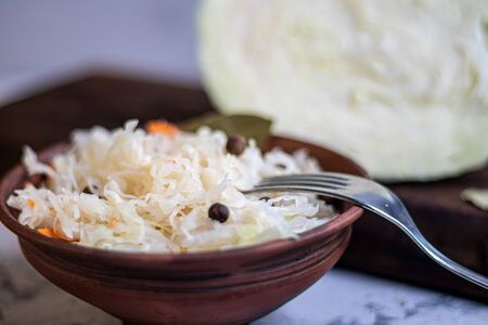 Plate with sour cabbage. This is a useful fermented product. Sour cabbage is rich in vitamins and is used in many dishes of different nations. The fermentation process does not destroy nutrients.の写真素材