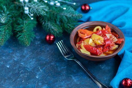 In glass jars Lecho salad of canned bell pepper and tomato. Harvesting for the winter. Vegetarian dish. Copy space.の写真素材