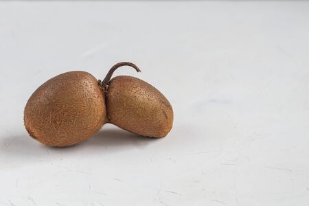 The ugly kiwi fruit. Tasty and healthy. Vegetarian food. On a light background. Copy space.の写真素材