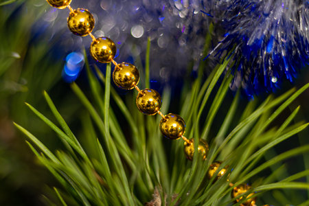 Christmas tree decorated with toys and sparkles. Against the background of blue, trend 2020. The...