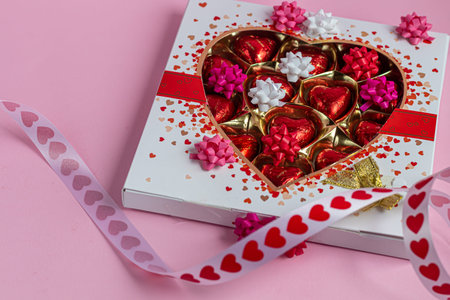 Mother's Day, Women's Day, Valentine's Day or birthday on a pink background. Candy in the shape of a...