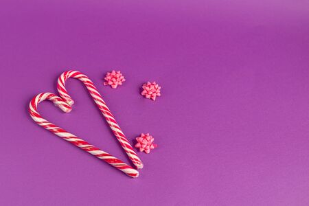 Mother's Day, Women's Day, Valentine's Day or birthday on a lilac background. Hearts of different colors and candies, ribbons suitable for greeting cards. Copy space.の写真素材