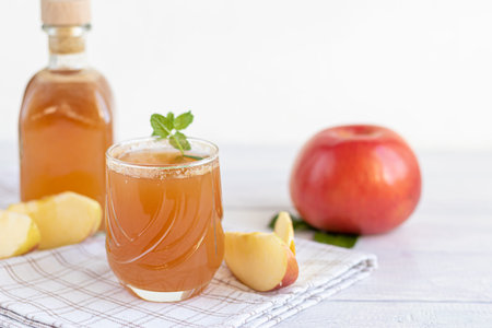 Freshly squeezed apple juice on a white background. Useful vitamin, antiviral drink. Copy space