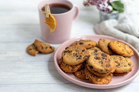 Chocolate Chip Cookies. Homemade baking. Round shape, medium size. On a white wooden background....