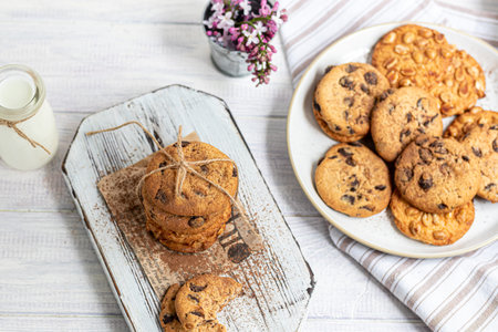 Chocolate Chip Cookies. Homemade baking. Round shape, medium size. On a white wooden background....