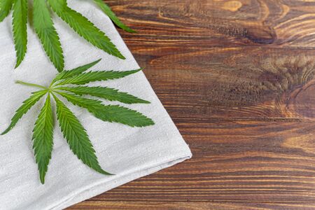 Cannabis fabric and rope on wooden background. Industrial production. Copy spaceの写真素材