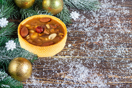 Cheesecake on a wooden background. New Year's composition. Christmas, winter, new year concept. Copy...