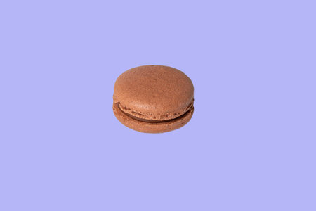 Round multicolored macaroon cakes on a light background. Home delivery. Festive concept. Quarantine. Copy space.の写真素材