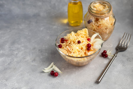 A plate with sauerkraut. This is a healthy fermented milk product. Sauerkraut is rich in vitamins...