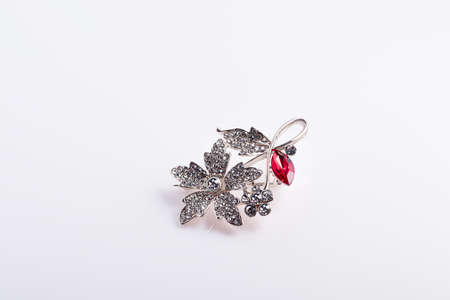 Bijouterie and jewelry on a white background. Brooches and hairpins, earrings and pendants. Isolate. Copy spaceの写真素材