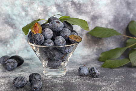 Plums on a light background. Harvesting the autumn harvest. Making jam and sauce. Still life.
